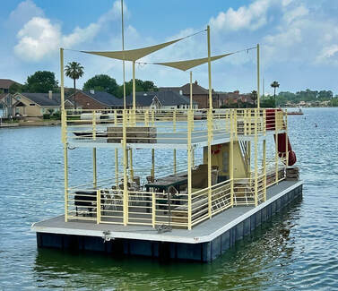Yellow Party Barge from Nauti-Dayz Boat Rentals on Lake Conroe, ideal for group events, lake parties, and fun family outings in Montgomery, Texas